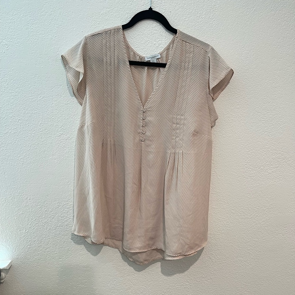 Pink and black polka-dot blouse